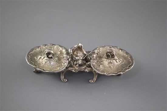 An 18th century French rococco white metal double salt, with hinged covers, on scrolling feet, marks quite rubbed, 18.3cm, 12.5oz,